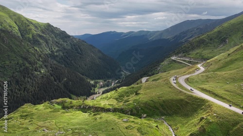 Sunlit Hairpins Across Carpathian Green Slopes
