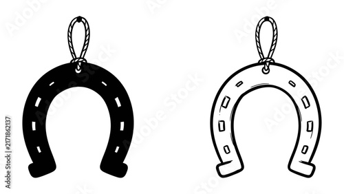 Good Luck Charm: A pair of stylized horseshoes, one solid black and the other outlined in white, hang as symbols of luck and good fortune.