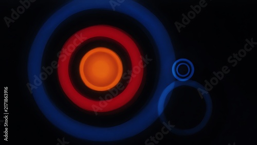 Abstract composition of glowing blue and red target rings with floating secondary circles on black background, created with generative ai.
