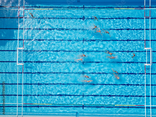 Top Down Aerial View of Water Polo Players Passing Ball During Match Game
