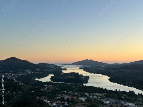 Sunset landscape view of River Minho winding through valley and mountains, Vila Nova de Cerveira, Viana do Castelo, Portugal, July 2025