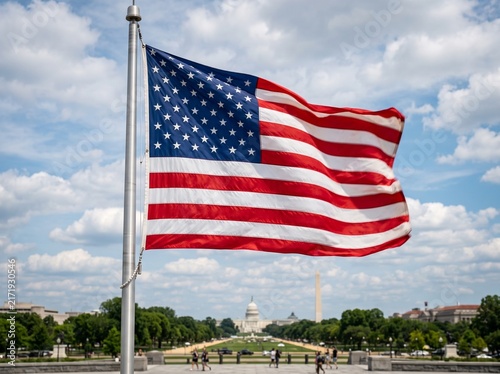 American Flag Waving Proudly Over a City Street Under Clear Blue Sky
