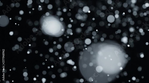 Abstract falling particles gentle light motion background