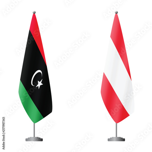 Bild auf Leinwand Libya and Austria flags on flagpoles for official ceremonies and meetings, trans