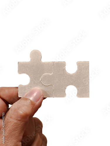 фотографія Woman Hand Holding Connected Jigsaw Puzzle Pieces Isolated on Transparent Backgr