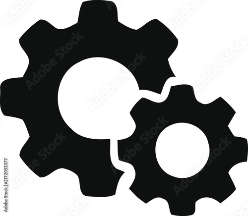 Black silhouette of two interlocking mechanical gears isolated on a white background representing engineering and industrial concepts