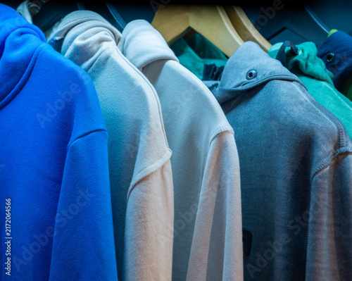 Colorful Hoodies Hanging on Rack
