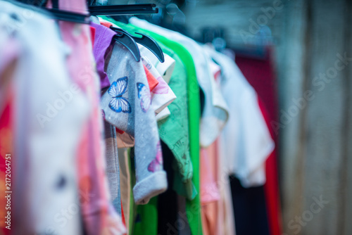 Row of Women's Clothing in Closet, Close-Up with Shallow Depth of Field