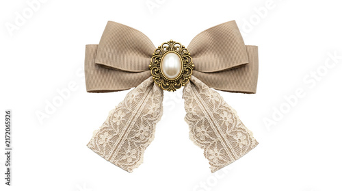 Fotografie Elegant beige fabric bow featuring detailed lace ribbons and ornate vintage pear