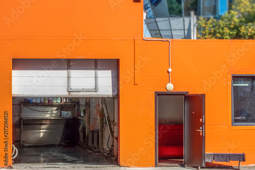 An empty car repair shop on a summer day