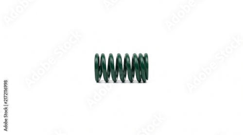 Macro of a pneumatic HVAC damper actuator return spring. Heavy-duty coiled steel with dark green anti-corrosion epoxy coating for industrial environmental control hardware systems.