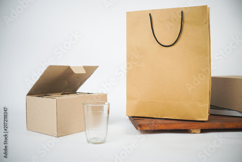 Paper shopping bag and takeaway box with water glass