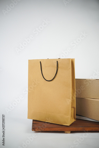Kraft shopping bag and cardboard delivery boxes