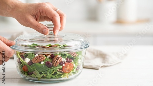 Fresh Healthy Salad In A Glass Bowl With A Lid In The Kitchen