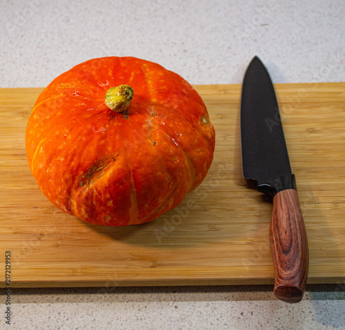 Obraz na plátně Step by step process of preparing organic pumpkin for baking in home kitchen, autumn cooking, healthy meal prep, and seasonal harvest concept