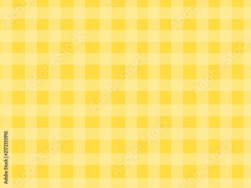 Yellow gingham background. Warm cheerful plaid background. Pink checkered texture. Classic checkered textile background for picnic, fashion, and summer designs.