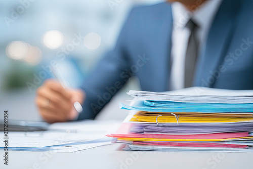 business accounting documents,auditor,management and auditing of office documents,Reports for Tax Time Analysis, Office worker working with documents, pre-approval quality assessment 