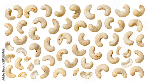 Numerous raw cashew nuts scattered in a random pattern, isolated on transparent background