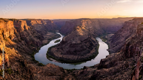 Winding river horseshoe bend in deep canyon