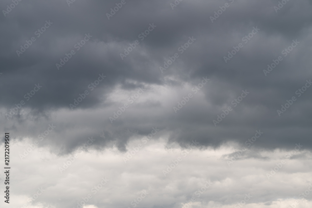 Obraz premium Dramatic clouds gather ominously over the landscape hinting at an impending storm