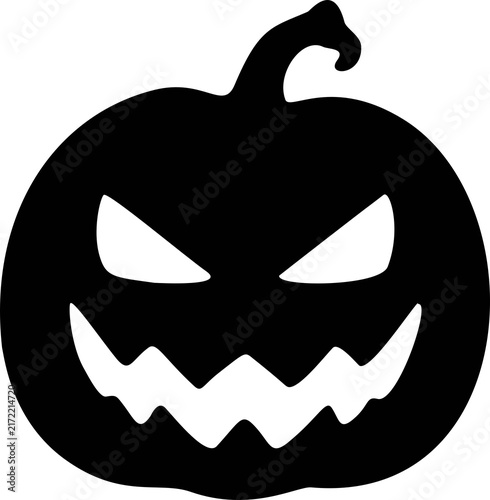 Fotografie Black pumpkin with evil glowing eyes, jagged teeth  perfect for spooky halloween designs