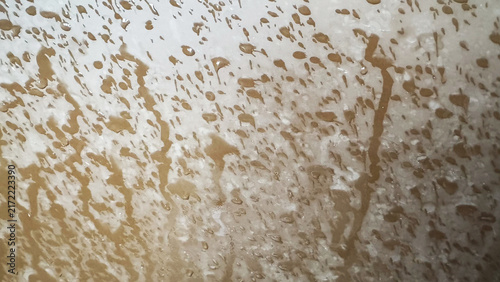 Close-up of stained and dirty textured wall surface