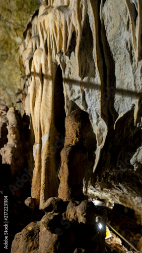 Canvas Print Stalagmite and flowstone inside a limestone cave