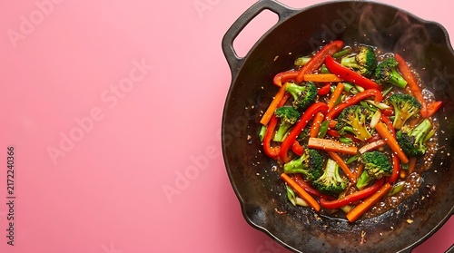 Fresh vegetable stir fry with broccoli and red bell peppers cooked in a cast iron skillet
