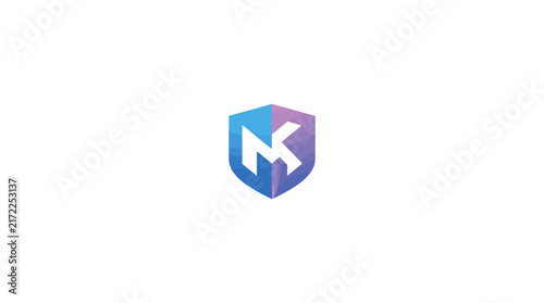 Blue geometric shield emblem with letter K inside