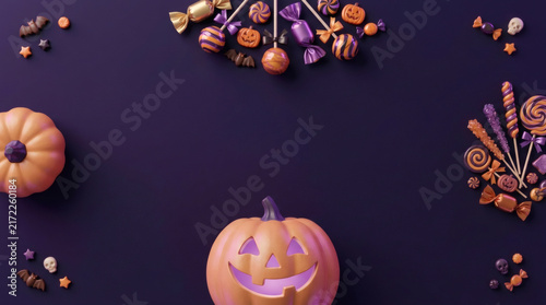 Elegant Halloween candy and jack-o'-lantern border on dark purple background