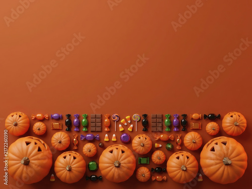Halloween pumpkin and candy grid border on burnt orange background