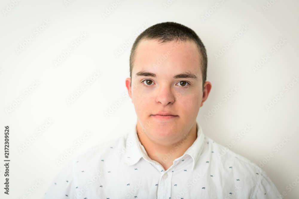 Fototapeta premium kid with Down syndrome over white background