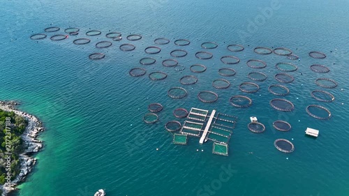 Aerial view of fish farm cages floating on the sea near Corfu island