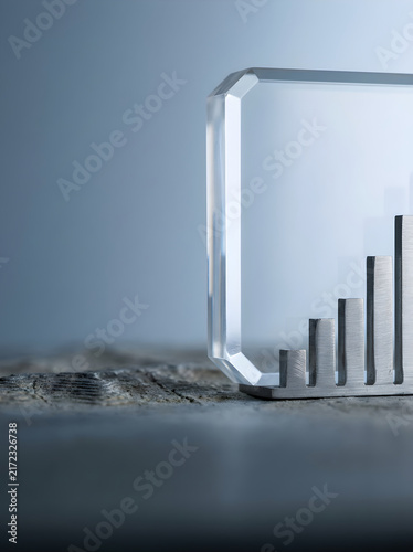 Modern business award with metallic bar graph showing growth and success
