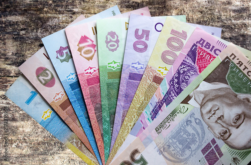 Fotografie Hryvnia Ukrainian national currency on a black background