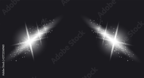 Bright white sparkling light arcs with glowing stars and particles on dark background.