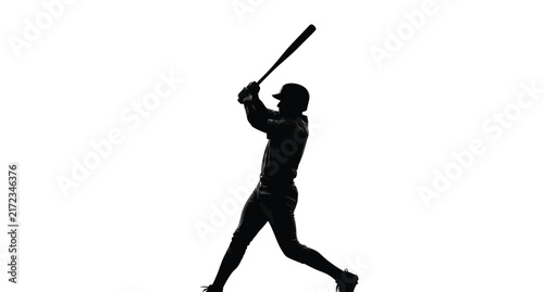 Baseball player swinging bat in action dark silhouette batter batting