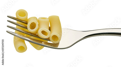 Fotografie Several uncooked rigatoni pasta tubes impaled on a shiny metal fork, isolated on