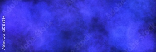 Fotografie Vibrant ultramarine and light blue watercolor smoke on a black background