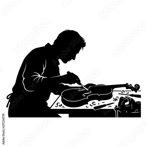 Bild auf Leinwand Silhouette of a luthier crafting and carving a violin in a workshop