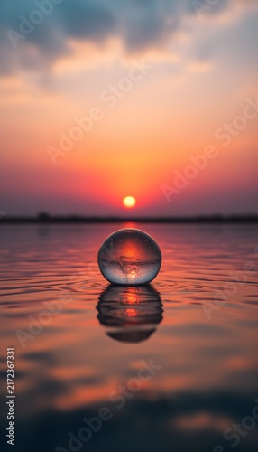 Sunrise horizon vibrant colors reflection in still water