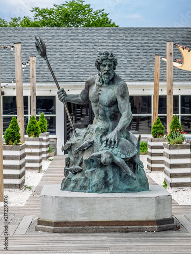 Bild auf Leinwand Hyannis, Massachusetts, USA - June 26, 2026: Neptune's statue on which he caress