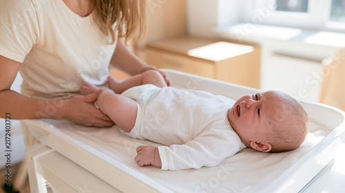 Newborn Baby Crying and Moving Legs During Diaper Change Routine