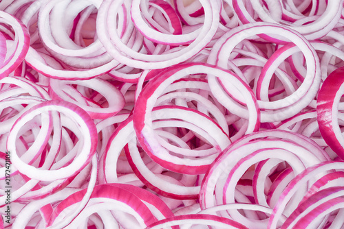 Onion rings as a background. Top view.