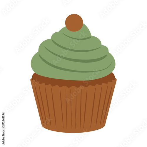 Green frosted cupcake with brown topping