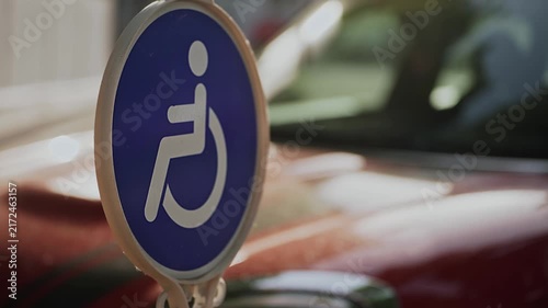 Designated accessible parking space marked with a disability symbol near a public facility. Scene represents universal design, inclusive urban planning, convenient mobility, and equal access.