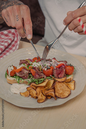 Gourmet breakfast with fresh croissants, toast and colorful fresh ingredients served on a table