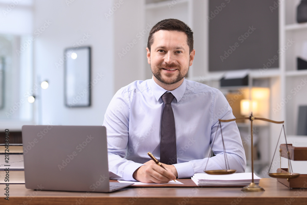Obraz premium Portrait of professional lawyer at desk in office