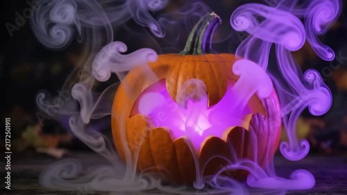 Eerie Premium 4K Seamless Loop Carved Bat Jack-o'-Lantern Emitting Ethereal Purple Smoke in a Spooky Dark Autumn Setting