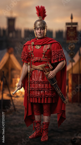 Roman centurion in full armor holding a scroll in military camp